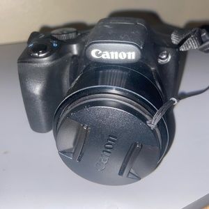 canon camera with a card and charger